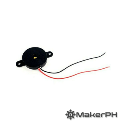 Black electric buzzer with red and black wires.